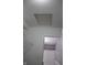 Bathroom with attic access and a partial view of the bath and shower at 8912 Hosta Way, Indianapolis, IN 46113