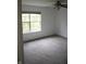 Carpeted bedroom featuring a window that provides natural light at 8912 Hosta Way, Indianapolis, IN 46113