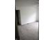 Bedroom with gray carpet and a doorway view into the hallway at 8912 Hosta Way, Indianapolis, IN 46113