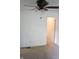 A bedroom with a ceiling fan and an open door leading to an adjacent room at 8912 Hosta Way, Indianapolis, IN 46113