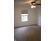 Bright bedroom featuring a window with natural light and neutral carpeting at 8912 Hosta Way, Indianapolis, IN 46113