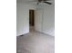 Bedroom with neutral carpeting and an open doorway leading to an adjacent room at 8912 Hosta Way, Indianapolis, IN 46113