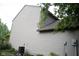 Side exterior view of home displaying vinyl siding, landscaping and a green yard at 8912 Hosta Way, Indianapolis, IN 46113