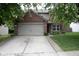 Charming two-story brick home with a well-maintained lawn and attached two-car garage at 8912 Hosta Way, Indianapolis, IN 46113