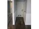 Hallway with white wainscoting on lower part of wall with gray vinyl flooring at 8912 Hosta Way, Indianapolis, IN 46113