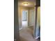 Carpeted hallway with view of bedroom and bathroom at 8912 Hosta Way, Indianapolis, IN 46113