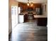 Open concept kitchen with stainless appliances, updated cabinetry and modern lighting at 8912 Hosta Way, Indianapolis, IN 46113