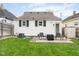 The home's inviting backyard has a patio and a grassy lawn, great for outdoor enjoyment and relaxation at 940 E Pleasant Run Parkway North Dr, Indianapolis, IN 46203