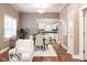 Open-concept living space with stylish dining area and hardwood floors, leading to the modern kitchen at 940 E Pleasant Run Parkway North Dr, Indianapolis, IN 46203