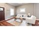 Comfortable living room with natural light and neutral decor, perfect for relaxing or entertaining guests at 940 E Pleasant Run Parkway North Dr, Indianapolis, IN 46203