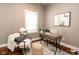 A cozy home office with natural light, a modern desk, and comfortable seating, perfect for remote work or study at 940 E Pleasant Run Parkway North Dr, Indianapolis, IN 46203