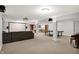 Spacious basement with home theater, ping pong table, and built-in shelving at 9583 Greenthread Dr, Zionsville, IN 46077