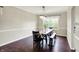 Cozy dining room featuring a wooden table set, stylish lighting, and hardwood floors at 9583 Greenthread Dr, Zionsville, IN 46077