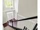 Bright foyer showcasing hardwood floors, a chandelier, and a staircase at 9583 Greenthread Dr, Zionsville, IN 46077