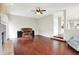 Open living room with hardwood floors, a fireplace, and ample natural light at 9583 Greenthread Dr, Zionsville, IN 46077