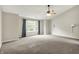Spacious main bedroom featuring vaulted ceiling, large window, and neutral carpet at 9583 Greenthread Dr, Zionsville, IN 46077