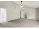Spacious main bedroom featuring a ceiling fan, ensuite bathroom, and walk-in closet at 9583 Greenthread Dr, Zionsville, IN 46077