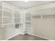 Walk-in closet with custom shelving providing ample storage space at 9583 Greenthread Dr, Zionsville, IN 46077