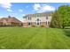 Spacious backyard featuring a fire pit and patio outside the home's exterior at 9749 Soaring Eagle Ln, Fishers, IN 46055