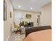 Versatile basement area with a bed and desk setup, blending comfort with productivity at 9749 Soaring Eagle Ln, Fishers, IN 46055