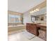 Bright bathroom with soaking tub, spacious vanity, and walk-in shower for a spa-like retreat at 9749 Soaring Eagle Ln, Fishers, IN 46055