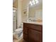 Well-lit bathroom featuring a glass-enclosed shower and a vanity with a neutral countertop at 9749 Soaring Eagle Ln, Fishers, IN 46055