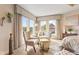 Bedroom with ample natural light, seating area, and calming decor at 9749 Soaring Eagle Ln, Fishers, IN 46055