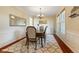 Elegant dining room featuring wainscoting, a chandelier, and large windows at 9749 Soaring Eagle Ln, Fishers, IN 46055