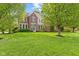 Charming brick home with beautiful lawn and mature trees offering great curb appeal at 9749 Soaring Eagle Ln, Fishers, IN 46055