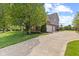 Large home with a three-car garage, a basketball hoop, and mature landscaping, offering both functionality and curb appeal at 9749 Soaring Eagle Ln, Fishers, IN 46055