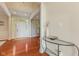 Inviting foyer with gleaming hardwood floors, white trim, and ample natural light at 9749 Soaring Eagle Ln, Fishers, IN 46055