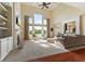 Bright and airy living room boasting soaring ceilings, a fireplace, and large windows at 9749 Soaring Eagle Ln, Fishers, IN 46055