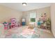 Bright playroom features a window, toys, a colorful rug, and ample storage at 9749 Soaring Eagle Ln, Fishers, IN 46055