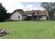 Expansive backyard with a well-maintained lawn and mature trees, great for outdoor recreation at 9903 E Raymond St, Indianapolis, IN 46239