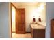 Bathroom featuring granite countertop and wood cabinets at 9903 E Raymond St, Indianapolis, IN 46239