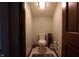 Small powder room featuring a commode and small fixtures at 9903 E Raymond St, Indianapolis, IN 46239