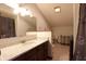 Bright bathroom with a wide mirror and granite countertop at 9903 E Raymond St, Indianapolis, IN 46239