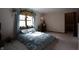Comfortable bedroom with large window and plants at 9903 E Raymond St, Indianapolis, IN 46239