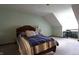 Comfortable bedroom with sloped ceiling and a cozy sleeping space at 9903 E Raymond St, Indianapolis, IN 46239