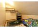 Cozy bedroom featuring carpet, closet, sloped ceiling and whimsical decor at 9903 E Raymond St, Indianapolis, IN 46239