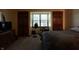 Cozy bedroom featuring plush bedding, natural light, and plenty of storage space at 9903 E Raymond St, Indianapolis, IN 46239