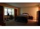 Tranquil bedroom with a comfortable bed, natural light, and ample closet space at 9903 E Raymond St, Indianapolis, IN 46239