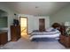 Bright bedroom with carpet and ensuite bathroom at 9903 E Raymond St, Indianapolis, IN 46239