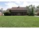 Charming brick home with a well-manicured lawn and inviting front entrance at 9903 E Raymond St, Indianapolis, IN 46239