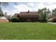 Charming brick home with a well-manicured lawn and inviting front entrance at 9903 E Raymond St, Indianapolis, IN 46239
