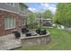 A cozy fire pit area with an outdoor gazebo adds plenty of space for entertaining guests in the back yard at 9950 Sugarleaf Pl, Fishers, IN 46038