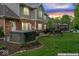 A tranquil backyard featuring a hot tub, fire pit, and a gazebo for relaxing or entertaining guests at 9950 Sugarleaf Pl, Fishers, IN 46038