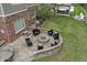 Aerial view of a cozy fire pit area with an outdoor gazebo that adds space for entertaining in the back yard at 9950 Sugarleaf Pl, Fishers, IN 46038