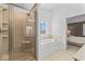 Bright bathroom featuring large walk-in shower and soaking tub at 9950 Sugarleaf Pl, Fishers, IN 46038