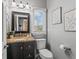 Well-lit bathroom with a granite vanity, modern fixtures, and neutral decor at 9950 Sugarleaf Pl, Fishers, IN 46038
